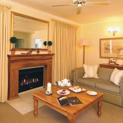 a living room filled with furniture and a fire place