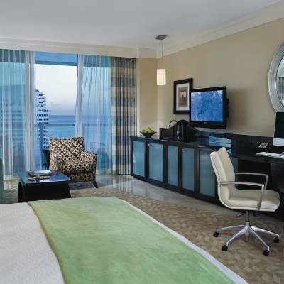 a living room filled with furniture and a large window