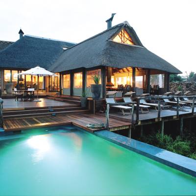 a house with a large pool of water