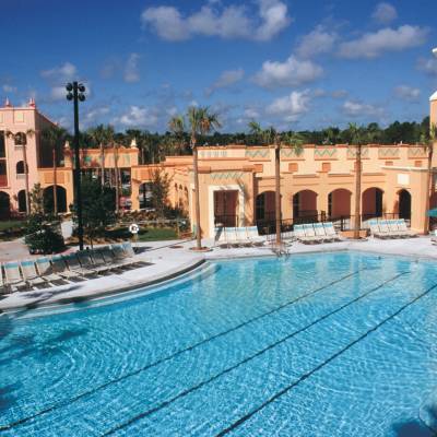 a person in a pool of water in front of a building