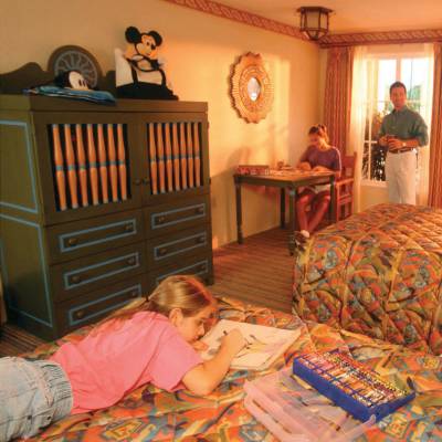 a group of people sitting on a bed