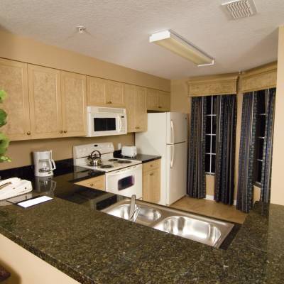 a kitchen with a sink and a refrigerator