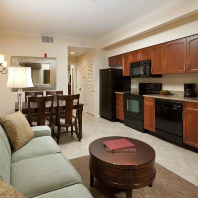 a living room filled with furniture and a flat screen tv