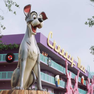 a horse statue in front of Disney's Pop Century Resort