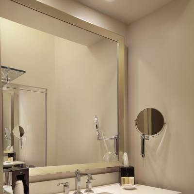 a double sink and large mirror
