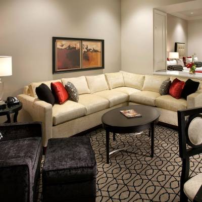 a large red chair in the living room