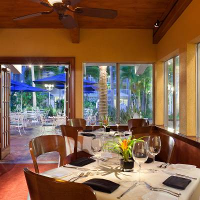 a dining room table in front of a window