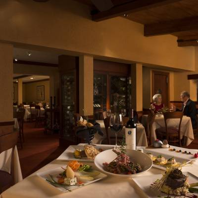 a group of people sitting at a table in a restaurant