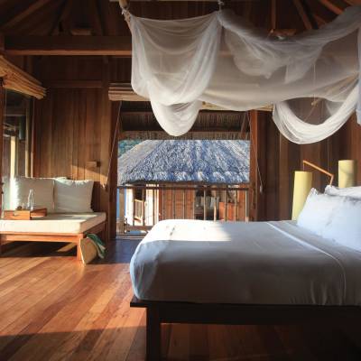 a bedroom with a large bed in a room