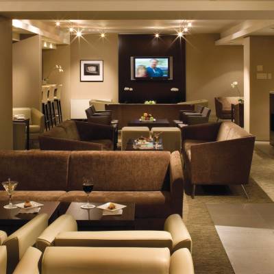 a living room filled with furniture and a flat screen tv