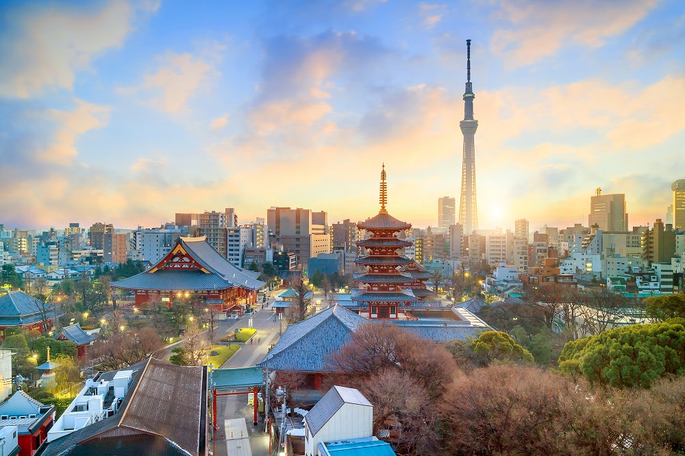 Enchanting Travels Japan Tours View of Tokyo skyline with Senso-ji Temple and Tokyo skytree at twilight in Japan Sensoji Temple against the Tokyo skyline