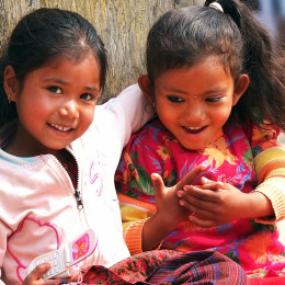 Kids sitting on the street of Kathmandu Enchanting Travels Nepal Tours - Nepal travel guide