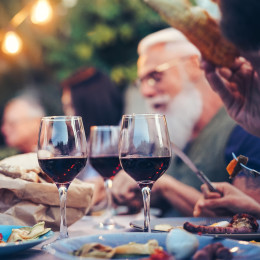Australia Tours family eating and drinking red wine at dinner barbecue party outdoor