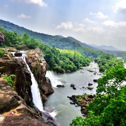 Witness the thundering Athirapally Waterfalls of Kerala during the monsoon season
