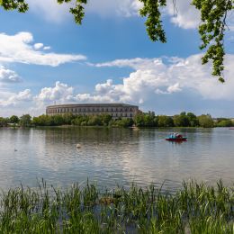 Enchanting Travels Germany Tours Panorama view of the Documentation Center and Congress Hall of the Nazi Party Rally Grounds in Nuremberg, with the Dutzendteich lake in the foreground, Bavaria, Germany - German History