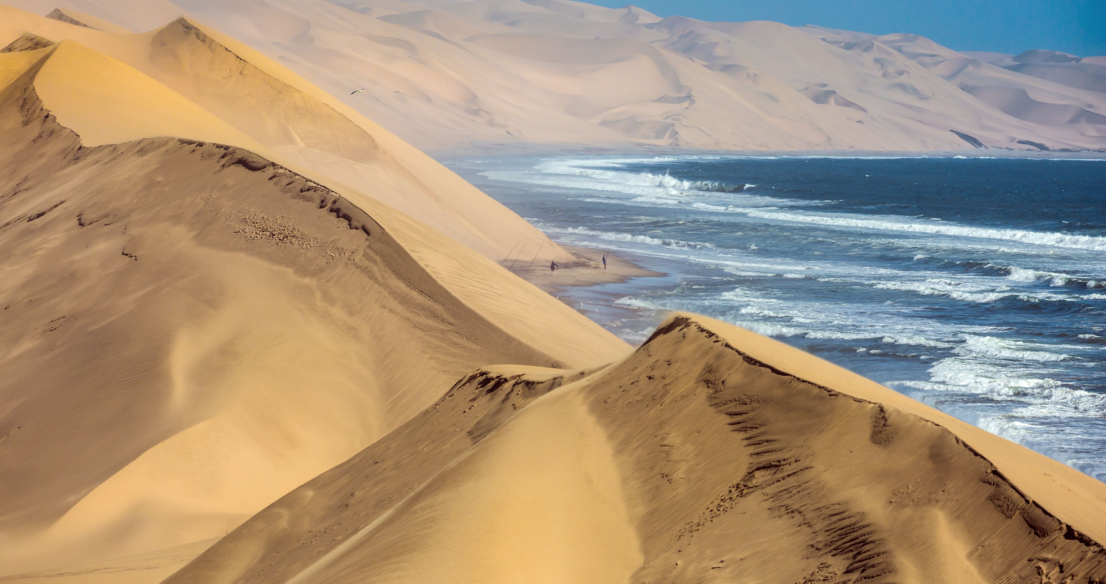 Enchanting-Travels-Africa-Namibia-15 Atlantic coast of Walvis Bay, Namibia. Ocean surf with foamy waves - Namibia travel guide