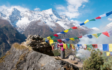 Nepali women replacing prayer flags, Namche Bazaar village, Sagarmatha Park, Himalayas, Nepal