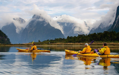 Enchanting Travels New Zealand Tours sea kayak in Milford Sound, New Zealand