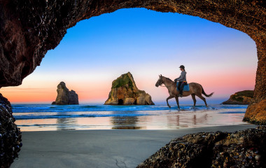Enchanting Travels New Zealand tours view from the cave of Wharariki Beach