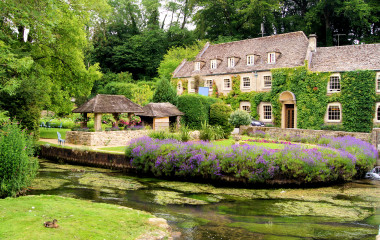 Picturesque garden in the Cotswold village of Bibury, England