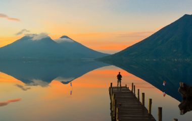 Enchanting Travels Guatemala Tours Observing the incredible beautiful sunrise at Lake Atitlan in Guatemala.