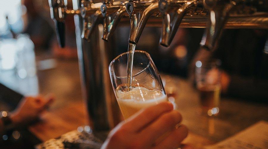 A pint of beer being poured