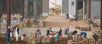 In a traditional warehouse setting, workers in 18th-century attire are busy with trade activities, weighing goods and packing boxes. Two men in Western clothing observe, while others carry boxes. A ship is visible through an open entrance.