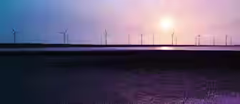 A serene landscape features numerous wind turbines on the horizon, silhouetted against a vivid sunset sky with hues of purple, pink, and blue. The turbines are reflected in a body of water below, with a dark and textured foreground adding depth to the scene.