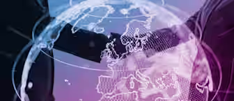 Two individuals in business attire shake hands, overlaid with a semi-transparent globe focused on Europe. The background is a gradient of blue and purple, suggesting themes of global collaboration and partnership.