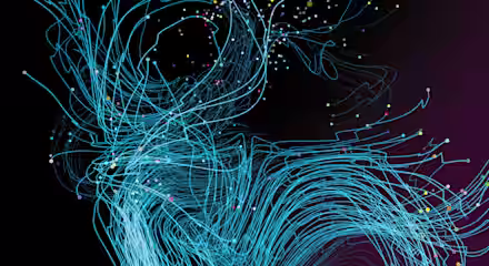 A digital artwork featuring swirling blue lines against a dark background. Tiny, colorful dots are scattered throughout the lines, adding a dynamic and intricate feel to the composition. The image evokes a sense of motion and complexity.