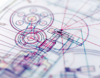 A close-up of a technical drawing or blueprint featuring intricate and overlapping lines, circles, and geometrical shapes in various colors like red, blue, and purple. The design appears complex, with mechanical and architectural elements intersecting.