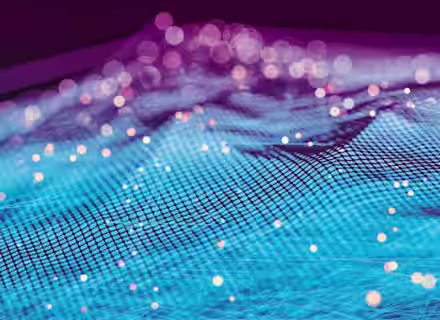 A digital abstract image featuring a 3D grid-like surface with blue and purple hues. Small, glowing orbs in various sizes are scattered across the surface, creating an ethereal, futuristic atmosphere with a bokeh effect in the background.