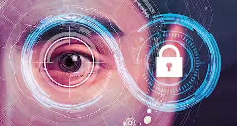 Close-up of a person's eye surrounded by digital and biometric interface elements, including circular patterns and a lock icon, representing cybersecurity and identity verification. The image conveys the integration of technology in security systems.