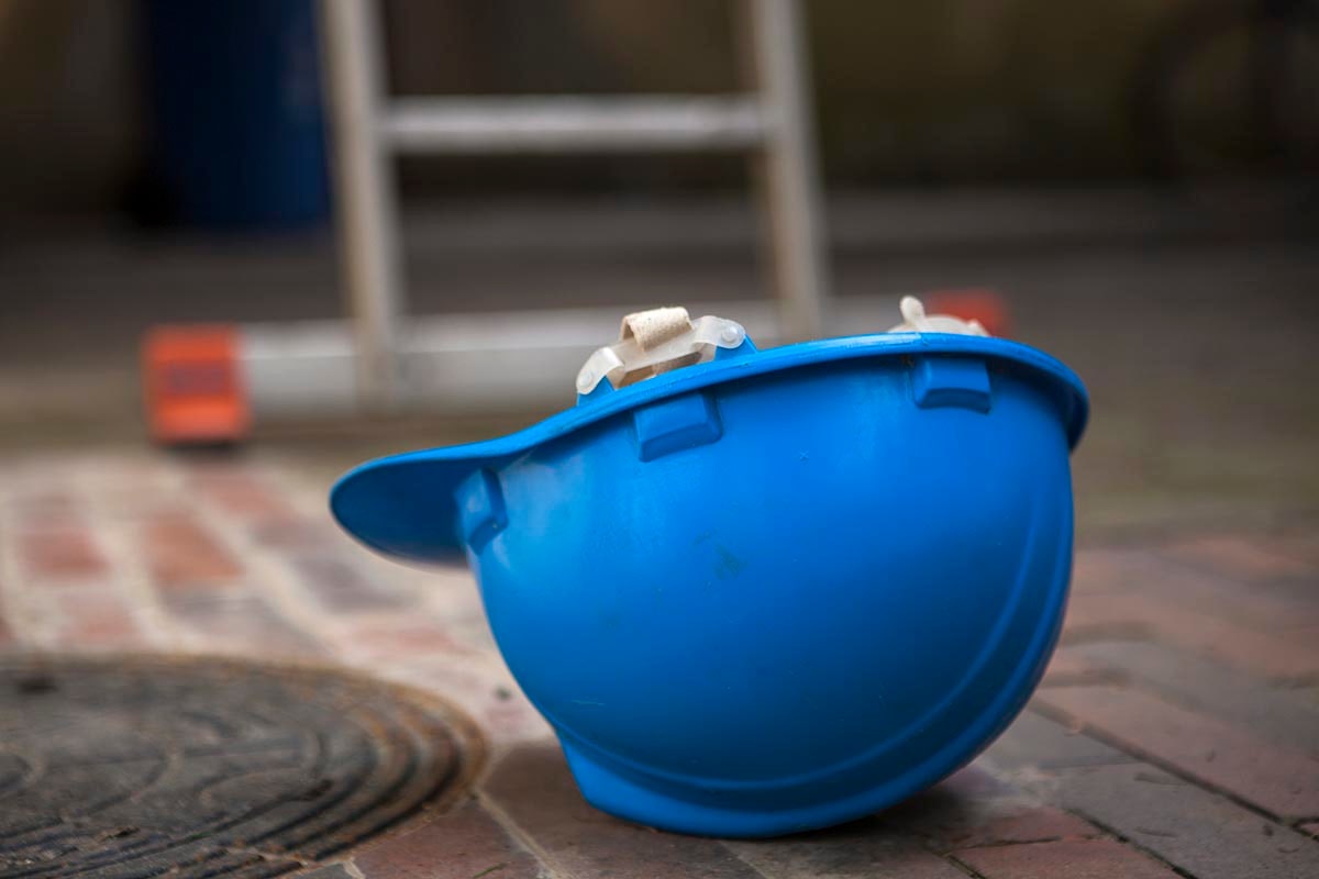 Damages for factory worker dragged into compactor machine at work