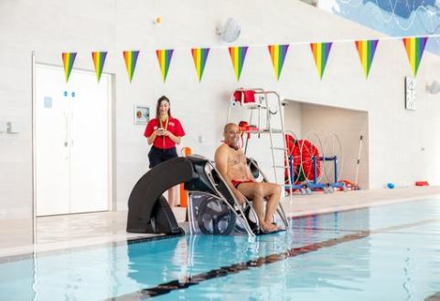 Member using the pool pod lift to get into the swimming pool