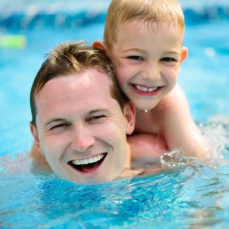Father and son enjoy swimming