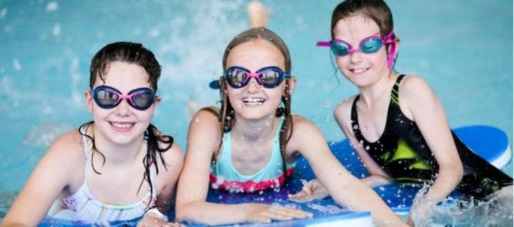 Children enjoying a swimming pool party