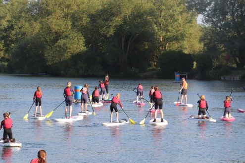 large group of paddleboarders on Stanborough Lake