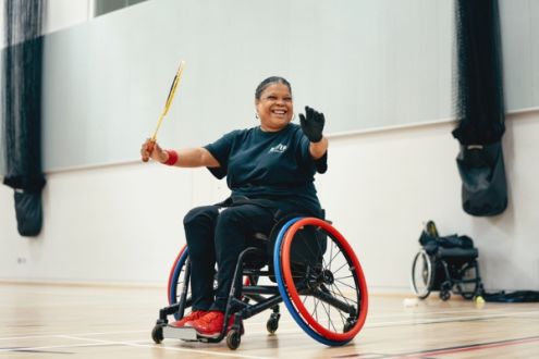 Woman on wheelchair playing badminton