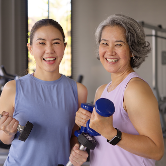 A girl and a woman at an Adult and Junior gym session A girl and a woman at an Adult and Junior gym session