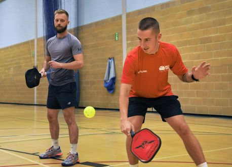 men playing pickleball