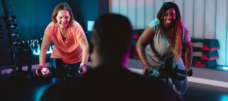 people in an exercise class with instructor