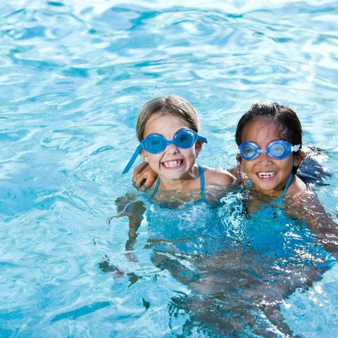 News_Story_Image_Crop-London_Fields_Lido_Swim.jpg Girls playing in swimming pool.