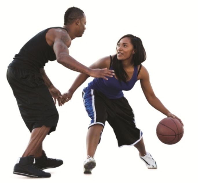 Man and woman playing basketball