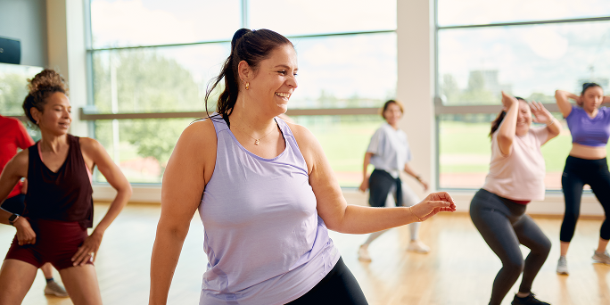 A woman working out in a dance class