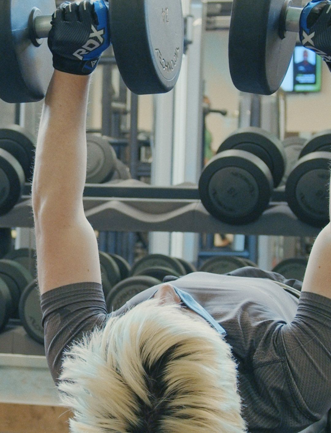 Kyle lifting weights