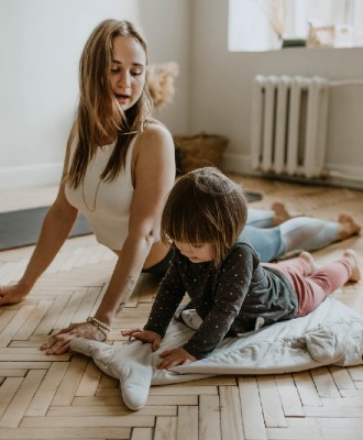 Woman and child doing yoga 330x400