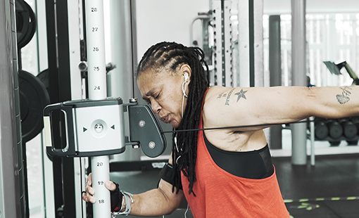 A woman using the machine in the gym