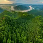 The Bend in the Danube River Surrounded by Trees