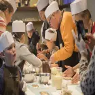 People and Children in Hats Making Chocolate